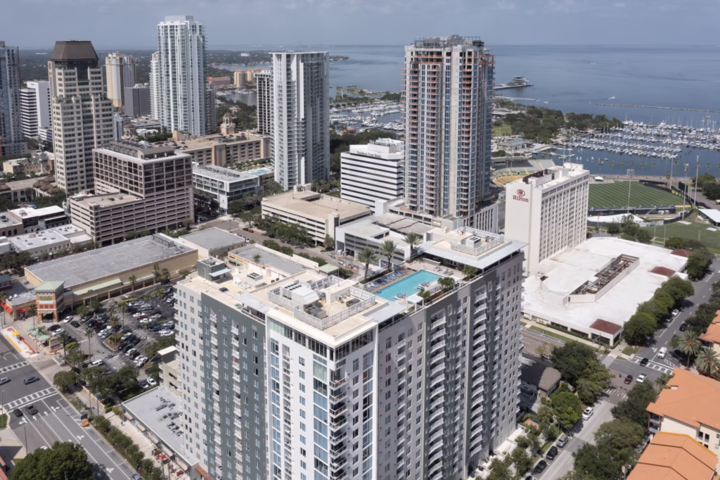 Daytime drone photo of Camden Pier District in directional morning light on the waterfront