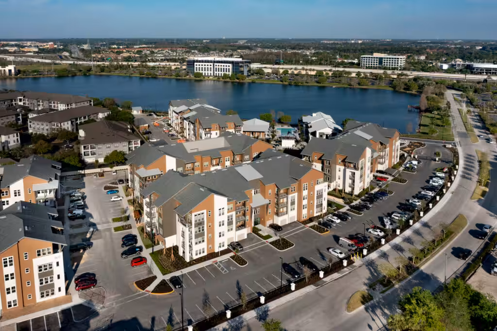 Drone aerial photo of a property exterior showing the building layout and surrounding landscape