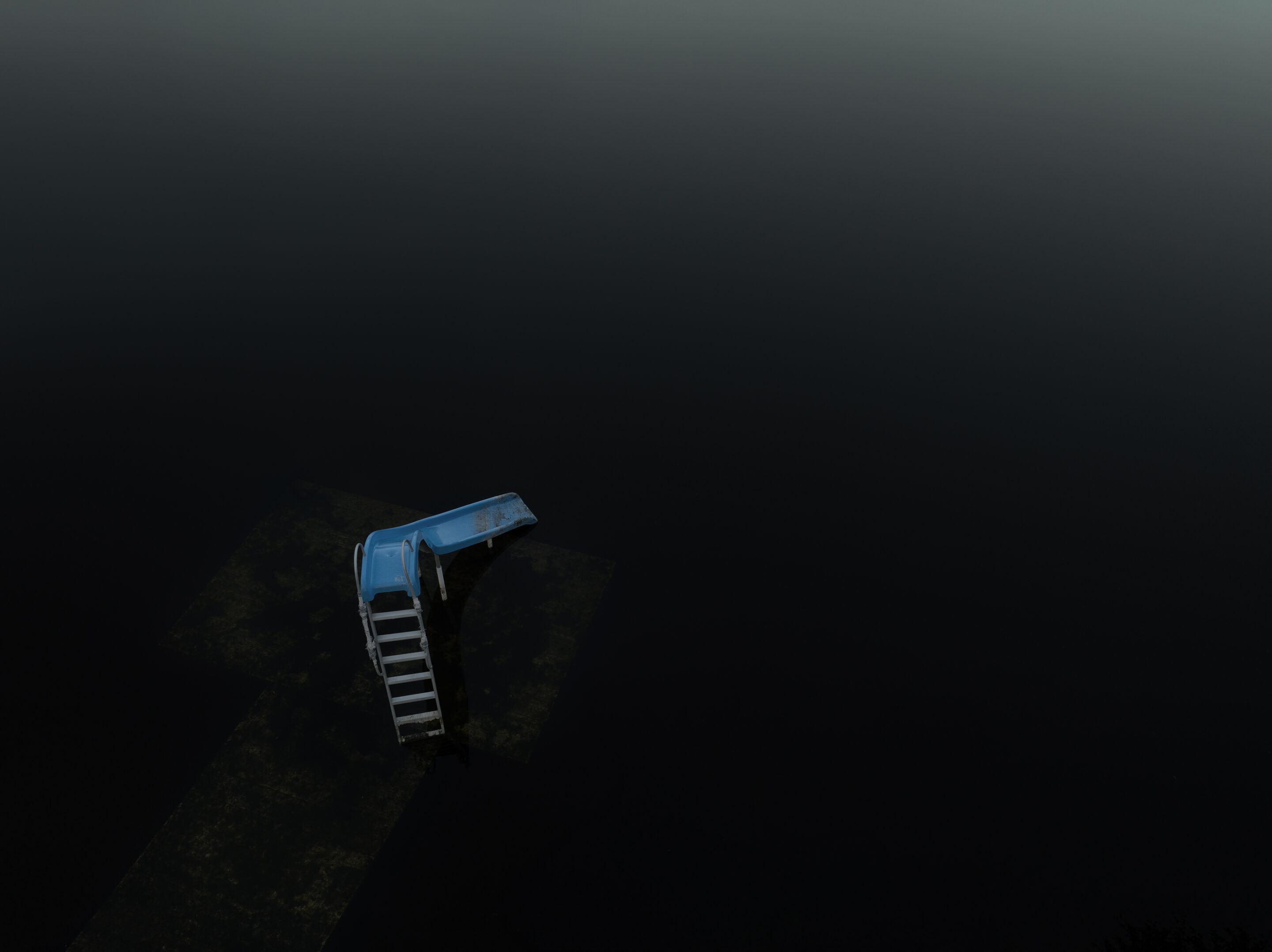A lonely blue slide descends into dark water, creating an isolated, mysterious atmosphere against a gradient sky backdrop.
